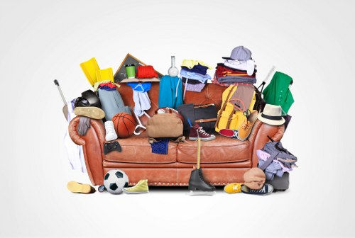 Cluttered garage before clearance in Shoreditch home