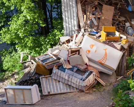 Workers clearing office furniture in a Shoreditch studio