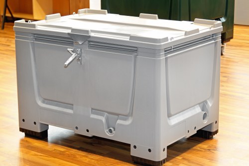 Low-emission electric van loading cardboard and mixed recycling